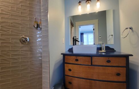 bathroom vanity and sink, walk-in shower