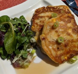 Corn and bacon pancakes with a side green salad